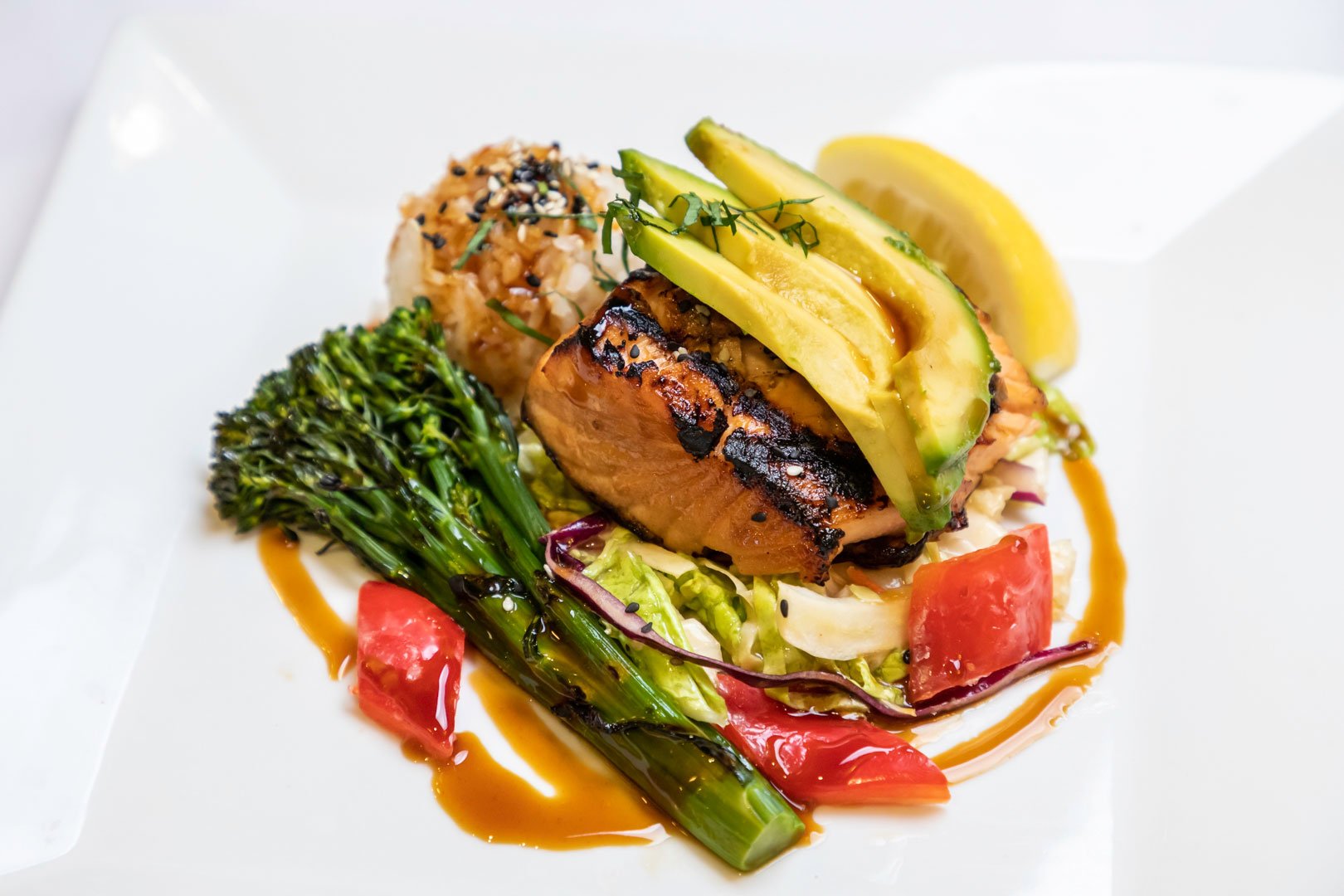 Plate of salmon, avocado, and asparagus